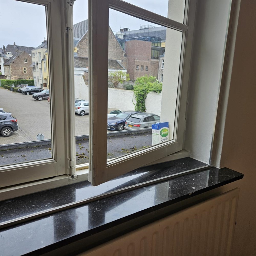 The milk carton on the windowsill